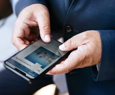 businessman-using-a-smartphone-2023-11-27-04-56-52-utc-min