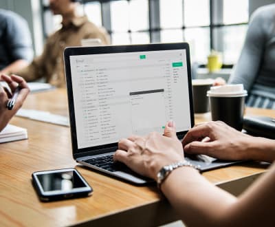 woman-checking-her-email-in-a-meeting-2023-11-27-05-18-46-utc